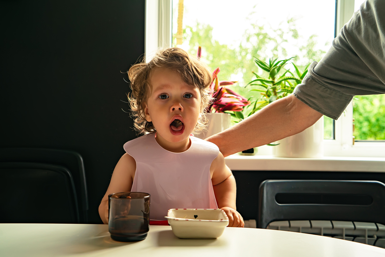 Small Child Choked On Food Eating In The Kitchen Indoors